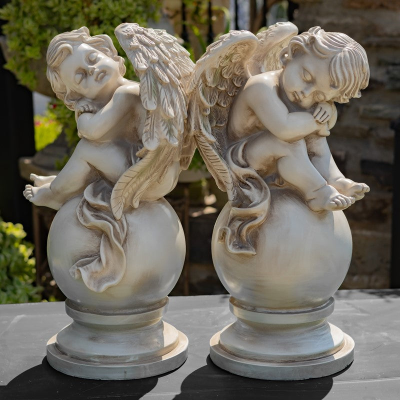 Set of Two 21" Tall Cherubs Sitting on Globe Pedestals "Yael & Cael"
